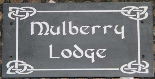 Slate house sign with celtic font and border