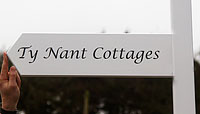 White painted arrow sign
