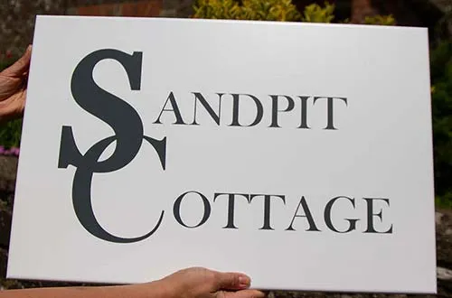 We have a huge number of fonts available White Painted House Sign With Black Text