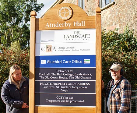 This sign was created using a combination of oak ad aluminium.