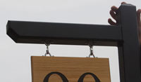 Post with arm for hanging sign Post with arm for hanging sign
