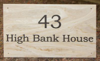 Plaque engraved using marble corian. Plaque engraved using marble corian.