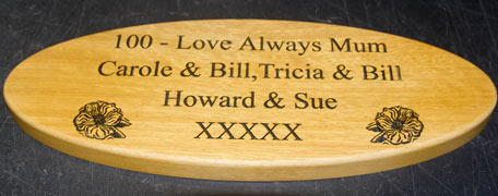 Oval engraved wooden sign
