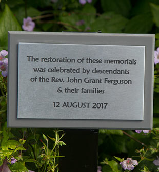 Laser engraved stainless steel plaque on a corian backing board with metal tree stake