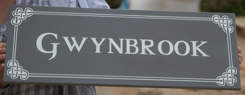 Slate coloured corian sign