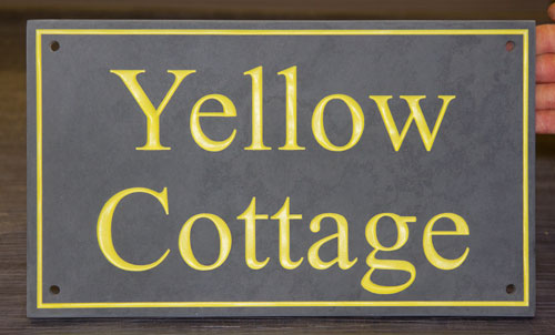 Slate house sign with yellow letters Slate house sign with yellow letters