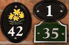 Cast aluiminium house number signs in various shapes.