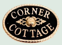 Cast brass house sign with rope edge
