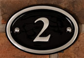 Polished aluminium house number.