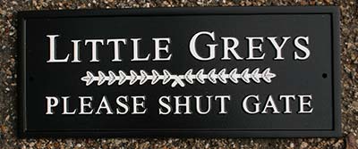 Rectangular cast house sign.