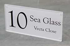 Clear acrylic address sign.