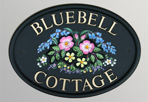 Cast motif with extra flowers painted on the sign