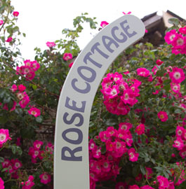 Rose cottage hockey stick sign.