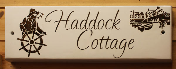 Laser engraved painted oak sign. Laser engraved painted oak sign.
