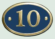 Oval cast brass sign.