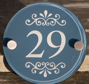 House number sign painted in stiffkey blue.