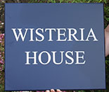 Painted Wooden House Sign. Painted Wooden House Sign.