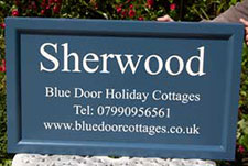 Painted tricoya sign board with wooden framed edge Painted tricoya sign board with wooden framed edge