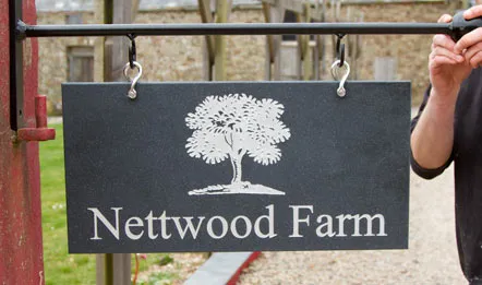 hanging engraved corian sign