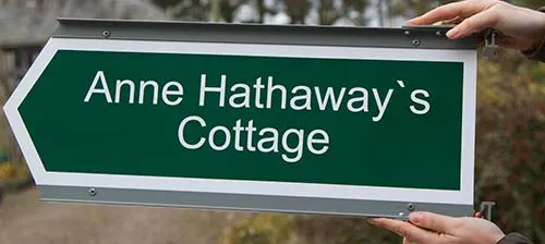 White aluminium finger with green vinyl applied Directional Arrow Sign