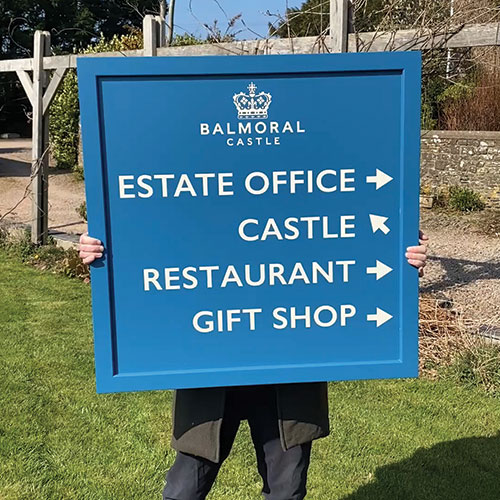 Painted wooden signs crafted by The Sign Maker for businesses and estates. 