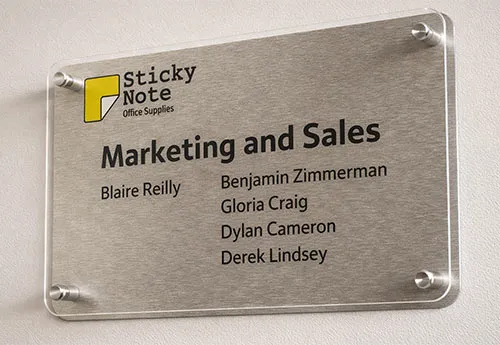 Clear Acrylic Sign Held over a Backing Board