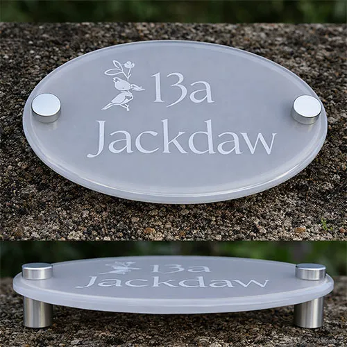 Painted clear acrylic house sign with laser etched lettering and stand-off fixings.