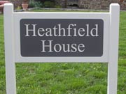 Painted entrance sign with engraved corian panel