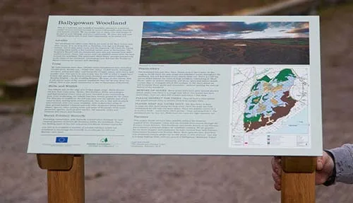 We also have wrought iron plaque holders. Large anoprinted panel on wooden lectern.