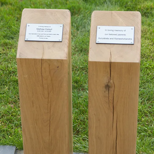 Green oak plinths with engraved plaques