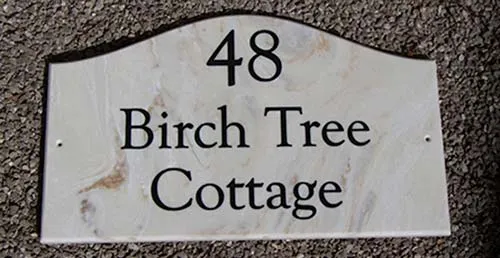 Corian house signs can be made into simple hapes. Engraved Stone-Like Corian House Signs