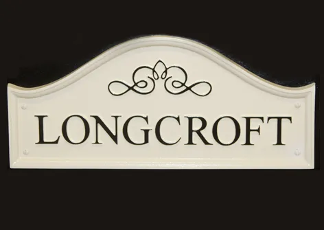 title here Dome top cast sign with scroll detail