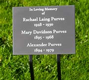 Engraved plaque on wrought iron tree stake.