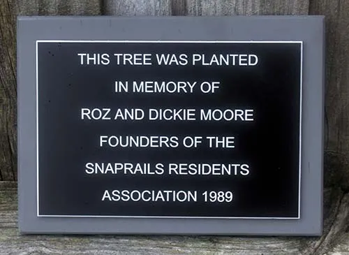 This has been mounted on a grey slate corian backing board Black Acrylic Plaque with Engraved White Text