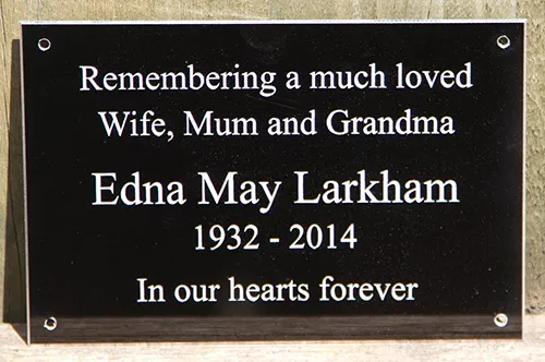 Black engraved memorial plaque
