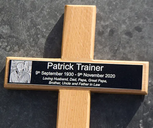 Wooden cross with black engraved plaque
