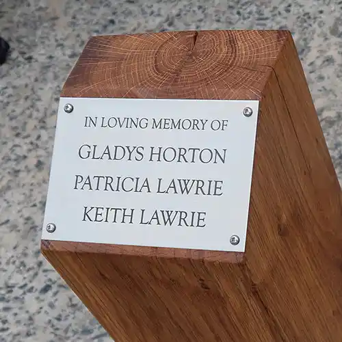 Green oak plinths with engraved plaques
