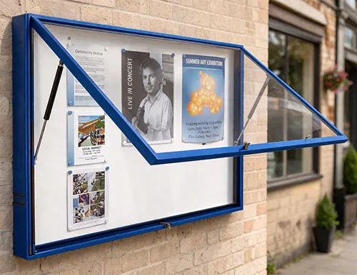 Wall mounted notice board with lift-up door and gas struts