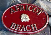 Oval cast brass sign.