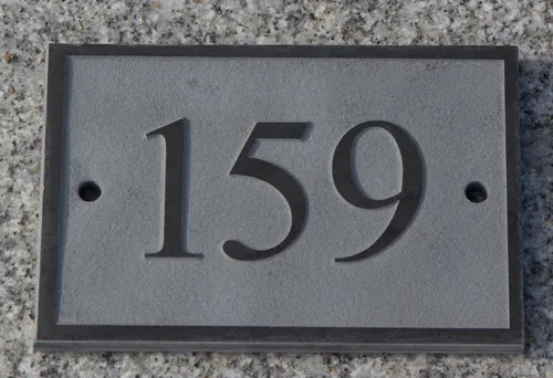 raised slate house number sign