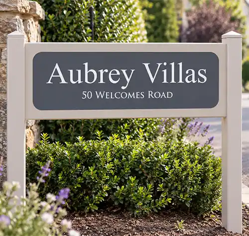 Handcrafted painted hardwood entrance sign with engraved corian plaque