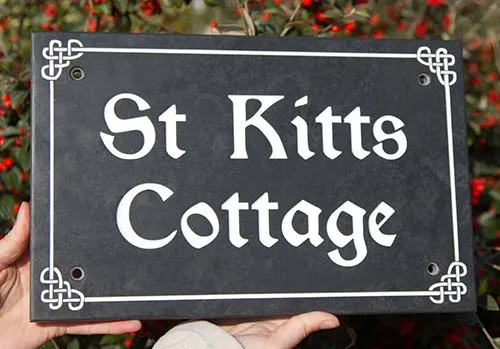 Celtic design on slate house sign.