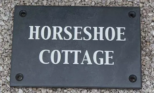 Slate house sign with countersunk holes
