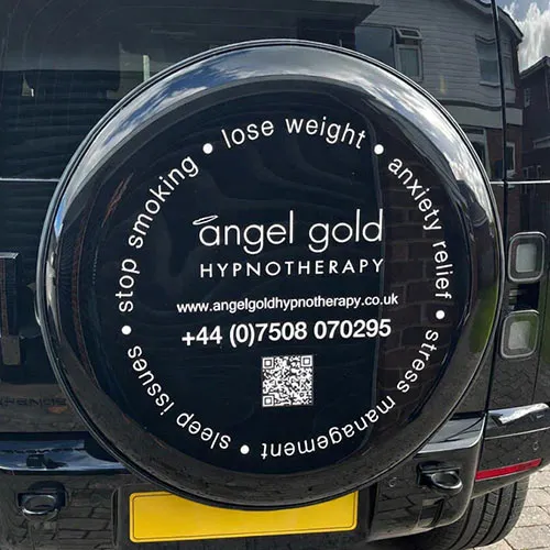 Wheel cover with cut vinyl lettering