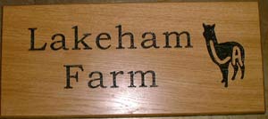 wooden sign with logo