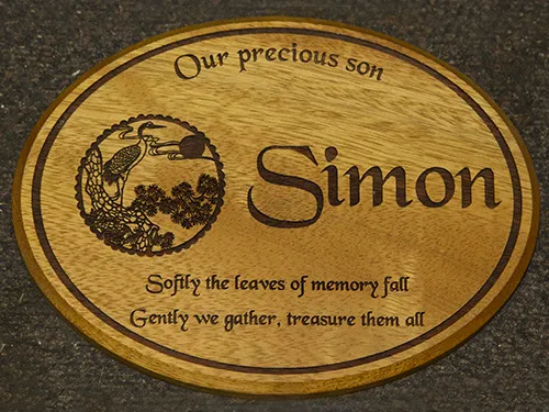 Oval wooden memorial plaque