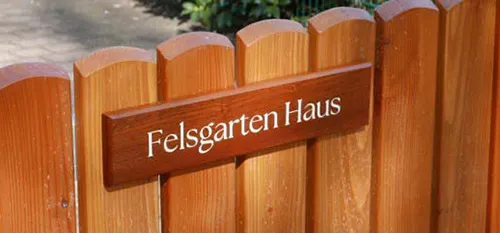 Sapele house sign on gate