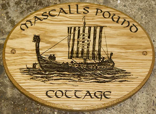 Wooden house sign with fine detail image