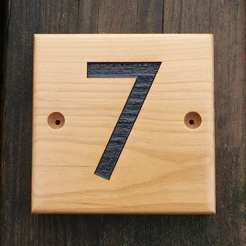 wooden house number sign