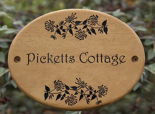 wooden oval detailed sign
